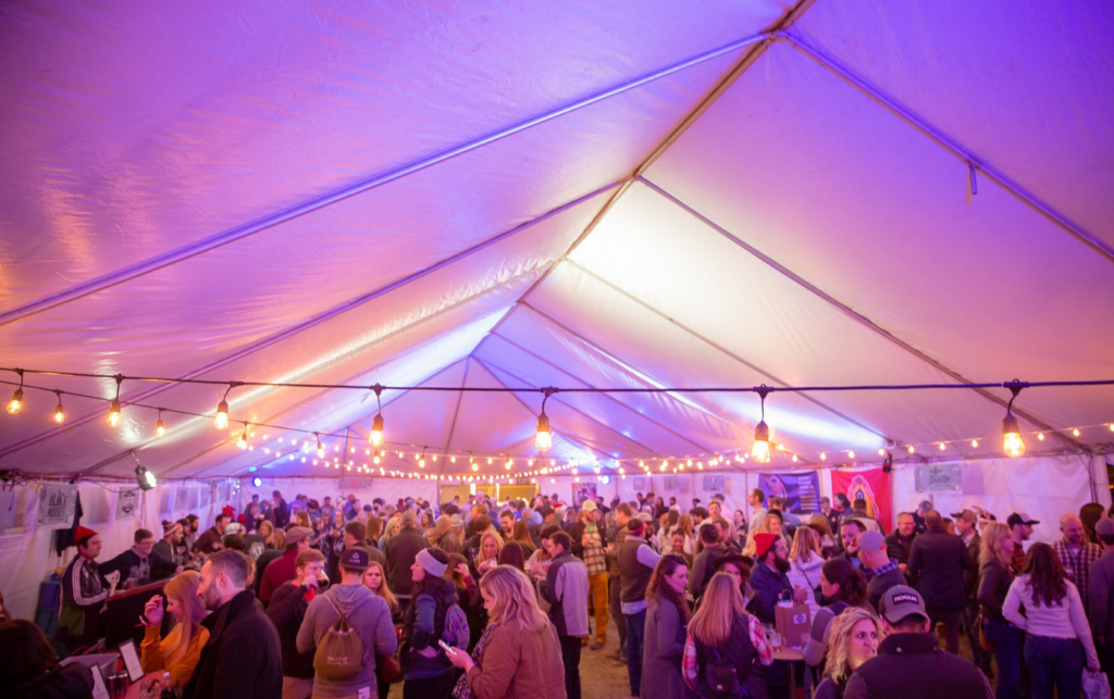 Elegant event tent with vibrant lighting