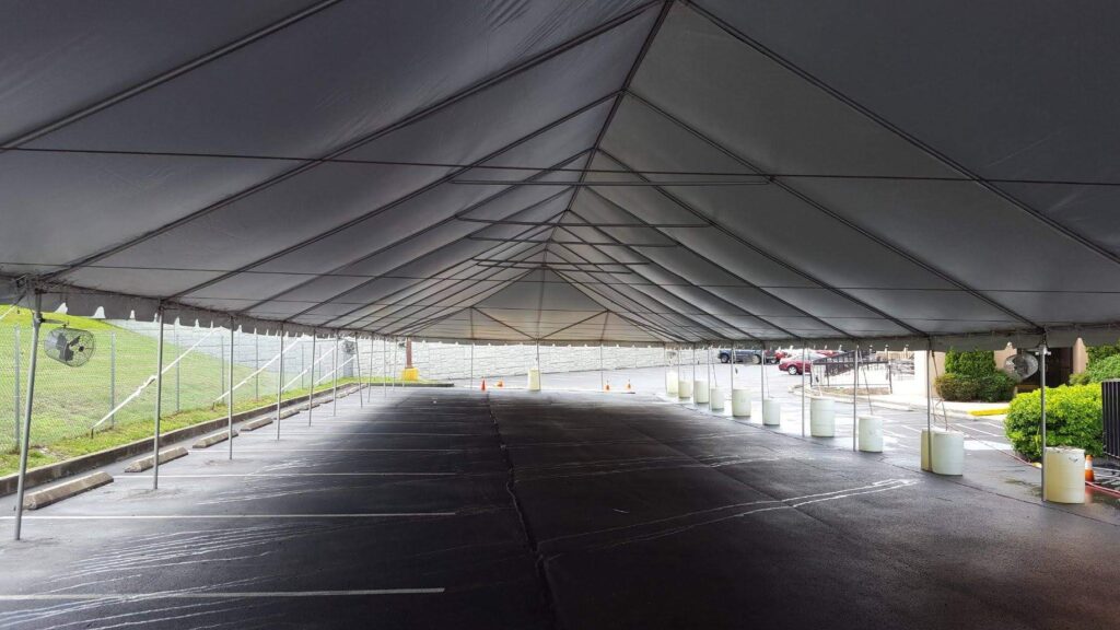 Long covered structure with fabric roof