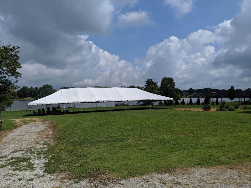 White tent beside waterfront